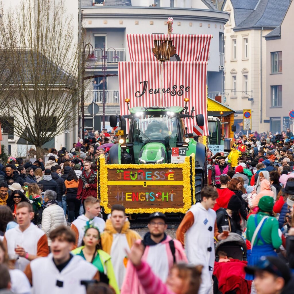 Carnival parade float and crowd at a public event