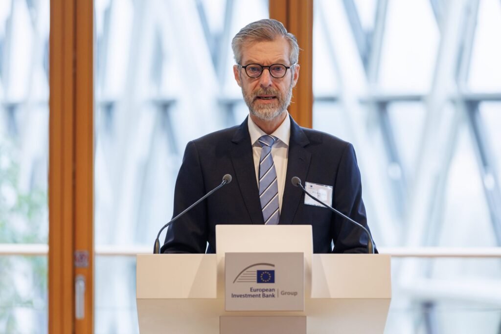 Speaker at a European Investment Bank podium