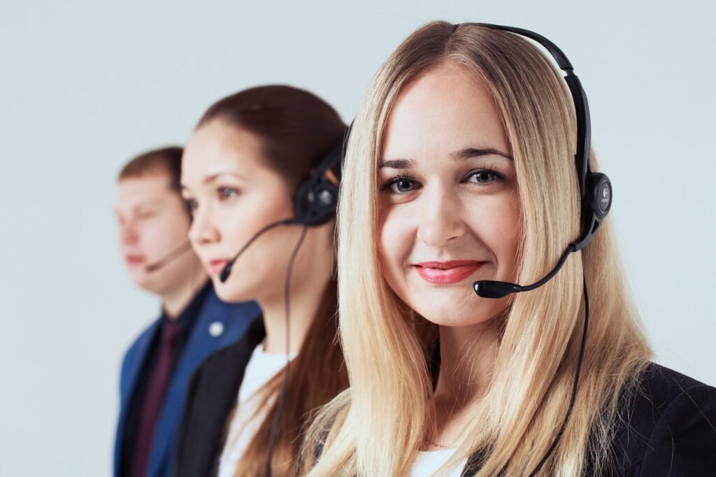 Team portrait of customer service staff with headsets